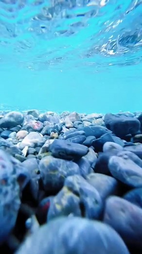 Stunning Underwater Views of Blue River Rocks