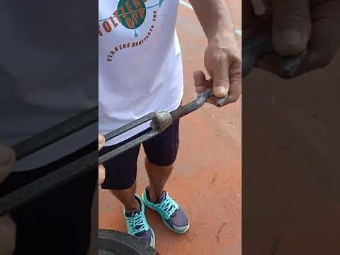 Installing of removable tennis net using turn buckle and movable steel post.