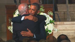 Obama hugs, kisses Biden after eulogy