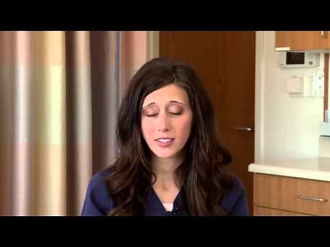 What causes white spots and swelling on tonsils, and should I see a doctor?