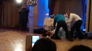 Groom really knocks bride off feet