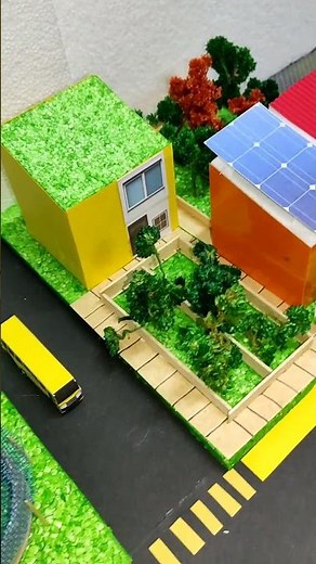 Maqueta de ciudad sustentable con paneles solares, ciclovía y huertos. #maquetas