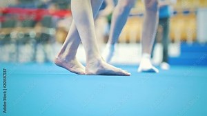 Feet of young woman gymnast competing at the stadium