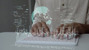 clip-1094891545-men-using-computer-connecting-cloud-computing-data