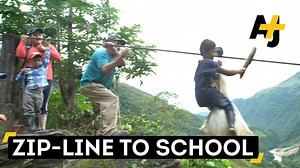 No school buses here. These kids in Colombia ride on a 1,300 feet high zip line to get to school. | AJ