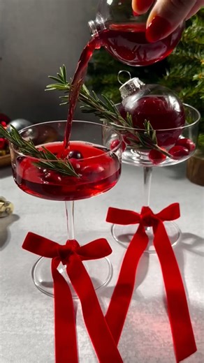 REVOLVE on Instagram: "The cutest holiday martinis you've ever seen 🎁🍸 @thats.thespirits is back with festive ornament martinis that are guaranteed to impress 😍🎄 Let us know in the comments if you're planning to try this out + see the recipe details below RECIPE DETAILS 👇 ✨ Tie bows around glass stems ✨ 2 oz vodka ✨ 2 oz cherry juice ✨ 1 oz cranberry juice ✨ 1 oz lime juice ✨ .5 oz cinnamon syrup ✨ Shake w/ ice ✨ Strain into plastic ornaments ✨ Place ornaments in martini glasses ✨ Garnish m