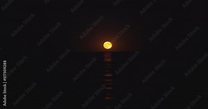 Sea twilight. Full moon rising over ripple ocean waves, romantic moonlight over water