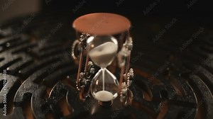 logic game round maze with balls, hourglass in the center of the circle