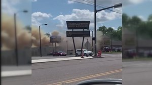 Crews working to control fire at Dollar General in Akron