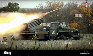 FILE - This handout photo taken from video released by Russian Defense Ministry Press Service on Oct. 4, 2022, shows a Grad multiple rocket launcher firing at Ukrainian troops at an undisclosed location. (Russian Defense Ministry Press Service photo via AP, File Stock Photo - Alamy