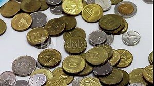 Israeli coins of the Bank of Israel. Israeli money is called Shekel, Sheqel, Shekels or Sheqalim. The slow motion video shows coins - 10, 5, 2 and 1 shekel, as well as smallest coins 50 and 10 agorot