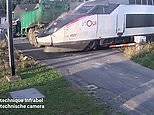 Shocking moment train ploughs through trailer stuck on railway crossing