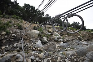 To reduce the risk of another deadly debris flow, the first of six ring nets was installed Tuesday in San Ysidro Canyon. The debris-control nets will be installed in spots that can catch flood material: two in San Ysidro Canyon, two in Cold Spring Canyon, and two in Buena Vista Canyon. The Partnership for Resilient Communities believes the protection provided by the nets may eventually affect the way red-zone lines are drawn, how evacuations are planned, and homeowners’ ability to get insurance.