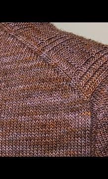 Seamlessly adding a sleeve to a top-down sweater