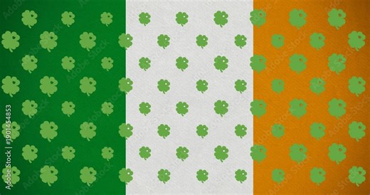 Digital animation of multiple clover leaves moving against irish flag