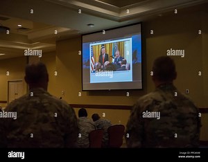 Leadership with the 1st Special Operations Wing and members of Airman Leadership School Class 18-F watch a live video from Hurlburt Field, Florida, as President Donald J. Trump presents the Medal of Honor to Valerie Nessel, the spouse of U.S. Air Force Tech. Sgt. John Chapman, during a ceremony at the White House in Washington, D.C., Aug. 22, 2018. Sergeant Chapman was posthumously awarded the Medal of Honor for actions on Takur Ghar mountain in Afghanistan on March 4, 2002, an elite special ope