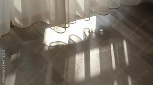 morning light fills the room, the curtain sways gently in the wind, casting shadows on the floor. Sunlight reflects off the window, creating a serene atmosphere to start your day