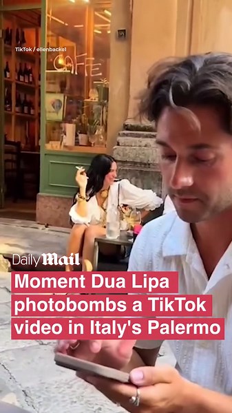 Moment British popstar Dua Lipa photobombs TikTok video while relaxing in Palermo