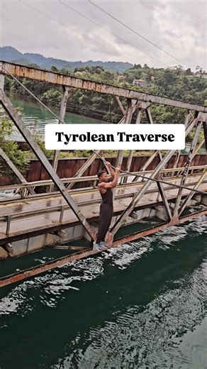 Using the Tyrolean Traverse technique for a river crossing. #bridgecrossing Whilst cossing a "full regain" during a Tyrolean traverse over water, where they must start from a hanging position and return to being on top of the rope, relying only on strength and skill. Immense strength, coordination, and technique to move, especially when suspended over high-consequence areas. #rivercrossing #tyroleantraverse | Sprytraining