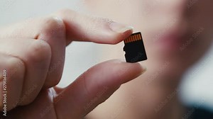 Micro sd card data storage technology held, depth of field shot