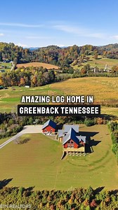 15 Acres | Greenback, Tennessee A handcrafted log residence positioned high above surrounding land, where panoramic mountain views meet open sky. The home blends cathedral scale, stone fireplaces, and expansive windows with usable acreage below. Outbuildings, fruit trees, and open ground add function to the setting. This isn’t just a log home. It’s mountain living, elevated. | Living in Nature