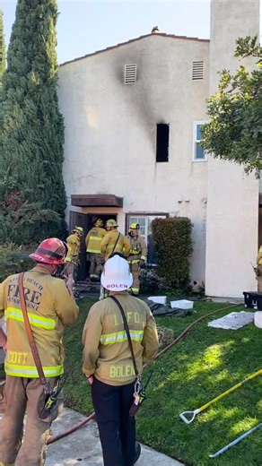 Today at 9:24 AM, @longbeachfirefighters responded to an apartment fire in the 3100 block of Atlantic Ave. First arriving crews encountered heavy smoke and fire coming from an upstairs unit, along with a dramatic rescue already in progress. A woman in her 30s was dangling from a second story window as nearby civilian workers rushed in to help, pulling her to safety before crews made entry. One patient was evaluated on scene. No firefighter injuries were reported. @redcrossla was requested to ass