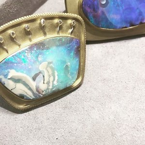 A deep dive into opal seascapes and landscapes, beautifully framed in 18k gold by artist-goldsmith Rob Greene. Spotted at Philadelphia Museum Of Art Craft Show. | The Jewelry Loupe
