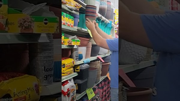 He buys a stack of Dollar Store flower pots for this genius front yard idea!