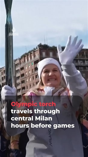 Right before the opening ceremony of the Winter Olympic Games, relay participants passed the torch for the final few times in central Milan. The flame began its journey across Italy in December, starting in Rome and travelling through all 110 Italian provinces. | Al Jazeera English