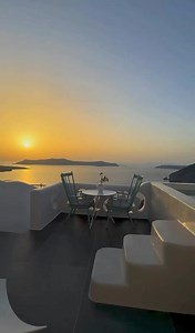 Gazing from the sanctuary of a suite at Athina Luxury Suites in Santorini, one is enveloped by the captivating spectacle of the sun's descent, as it delicately imbues the horizon with a palette of amber and rose, casting an enchanting aura over the Aegean Sea • https://www.athinasuites.com | Athina Luxury Suites