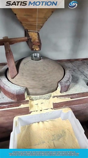 Grinding Corn With Rotating Stone Mill Producing Fine Powder Flow