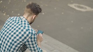 Back View Man Using Mobile Phone Stock Footage Video (100% Royalty-free) 1065824716 | Shutterstock
