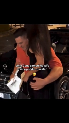 John Cena carrying his wife over a puddle of water 🥹🩷