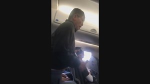 Passenger Dragged From Flight, Security Officer Put on Leave