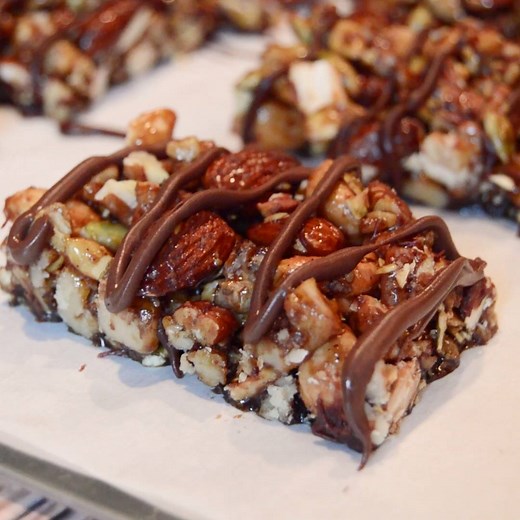 Our Paleo Nut Bar Recipe with Chocolate Drizzle is a healthy snack that is easy to make, loaded with nuts and seeds, and Gluten Free, Paleo, and Vegan!! http://www.aspicyperspective.com/paleo-nut-bar-recipe-with-chocolate-drizzle/ | A SPICY PERSPECTIVE