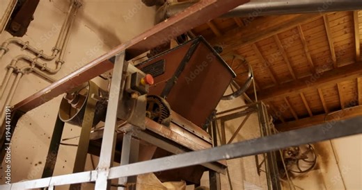 A green tea processing factory in a warehouse with machinery for drying and manufacturing.