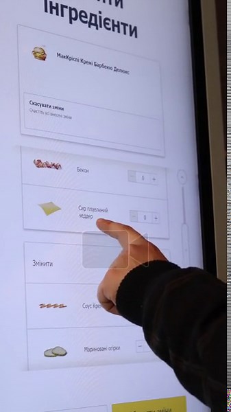 Kyiv, Ukraine - April 11, 2026: Close-up: a person uses the touchscreen of a McDonald's self-service kiosk in Ukraine. Focus on interaction with the digital interface in a fast food restaurant Stock Video Footage - Alamy