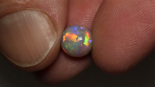 This epic gem crystal opal, is a feast for your eyes! 😍 Packed with every color of the rainbow, radiating with every turn of the gem. The play of color is intensified due to its beautiful high dome. https://blackopaldirect.com/products/2-58-ct-gem-crystal-opal-8-6x8-1x6-1mm | Black Opal Direct