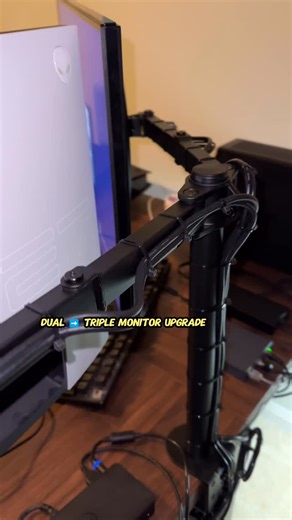 @techinsomnia on Instagram: "A simple dual-monitor desk turned into a clean, three-screen hybrid workstation. One triple-monitor mount, a UPS to clean the power, a dock, a switch — and now it handles remote work during the day and gaming at night with perfect cable management. Would you upgrade to triple monitors? #desksetup #techsetup #workfromhome"