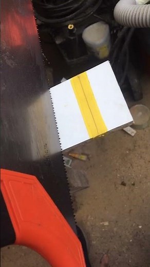 Cutting melamine with tape and an Irwin hand saw