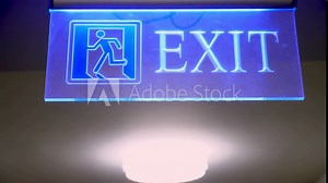 exit sign. exit icon. close-up. sign with the inscription exit, with blue backlight.