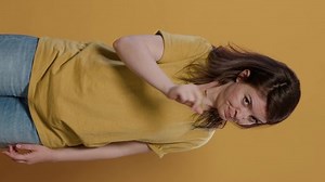 Angry upset woman arguing showing index finger pointing at guilty person punishing mischief in studio. Shouting girl looking unhappy and displeased asking for obedience and demanding respect.