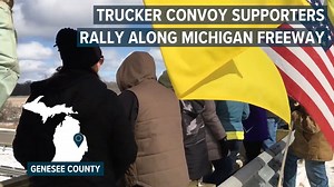 Supporters gathered on a bridge over US-23 just south of Flint, Michigan Friday to see off a trucker convoy headed to Washington, D.C. in protest of coronavirus mandates. | MLive.com