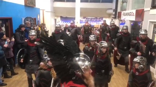 Guizer jarl Lynden Nicolson and his squad arrive at the Toll Clock shopping centre on Tuesday morning. #uphellyaa | Shetland News