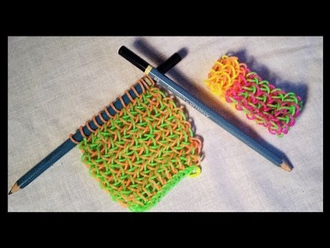 Knitted Dragon Scale bracelet on 2 pencils