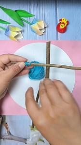 A cute little doll made with natural sticks and soft wool, giving it a cheerful handmade charm | hand made crafts for kids