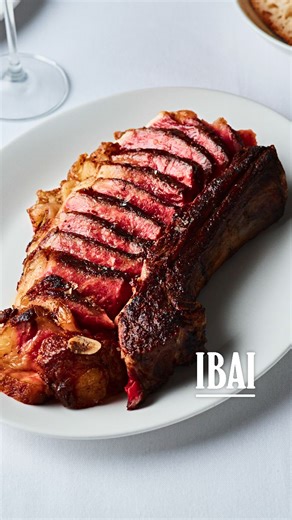 TOPJAW on Instagram: "Is this the best steak restaurant in London? Basque style indulgence at @ibai_london. A place to worship meat in a madmen-core interior.🥩Essential dishes: Croque Ibai: carabinero prawns, boudin noir, tomme de brebis, honey is pure decadence on a grilled toast. King Crab Rice: Cooked in a six-hour reduction of carabinero prawn bisque so deep you won’t have tasted anything like it. Galician Blond Steak: Meat from older dairy cows, rich in marbling and complexity. Cooked how