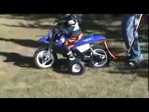 Nicholas first ride Yamaha PW50 throttle limited with Training Wheels