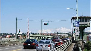 Why does the Ballard Bridge open during rush hour?