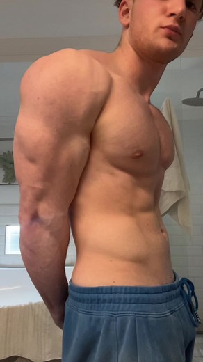Muscle Showcase: Fitness Selfies in Modern Bathroom